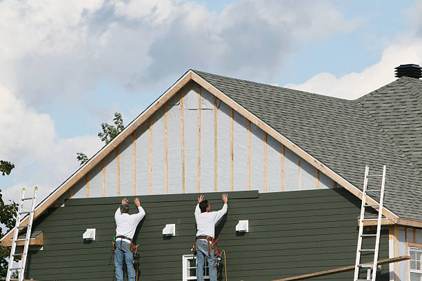Professional Siding technician working in Dayton, IN